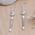 Blue topaz dangle earrings, 'Serene Journey' - Faceted Blue Topaz Sterling Silver Dangle Earrings from Bali