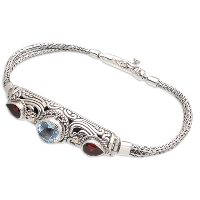 Gold-accented blue topaz and garnet pendant bracelet, 'Loyal Passion' - 18k Gold-Accented Pendant Bracelet with Faceted Gems