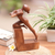 Wood sculpture, 'Free Beauty' - Hand-Carved Brown Suar Wood Sculpture of Flexing Woman