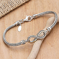 Gold-accented pendant bracelet, 'Infinite Modernity' - 18k Gold-Accented Sterling Silver Infinity Pendant Bracelet