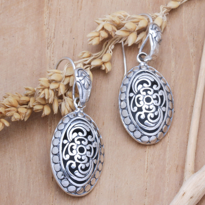 Sterling silver dangle earrings, 'Blooming Shell' - Sterling Silver Oval Dangle Earrings with Floral Motifs