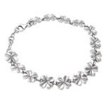 Sterling silver link bracelet, 'Chic Cloverleaf' - Sterling Silver Link Bracelet with Four-Leaf Clover Motif