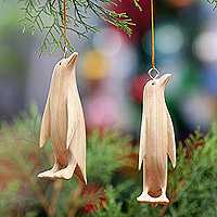 Wood ornaments, 'Adorable Penguins' (pair) - Pair of Hand-Carved Wood Penguin Christmas Ornaments