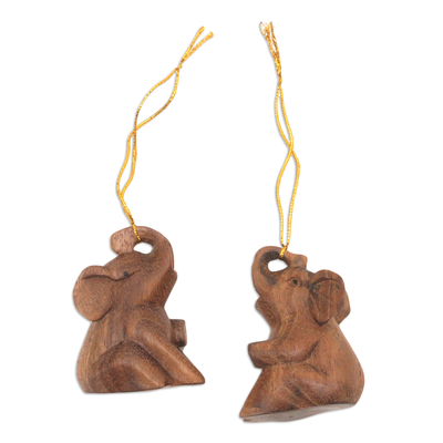 Wood ornaments, 'Giant Tenderness' (pair) - Pair of Suar Wood Baby Elephant Ornaments Carved in Bali