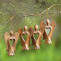 Wood ornaments, 'Fairy Hearts' (set of 4) - Set of 4 Hand-Carved Suar Wood Fairy Ornaments with Hearts