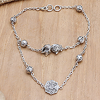 Sterling silver pendant bracelet, 'Floral Divinity' - Two-Strand Floral Pendant Bracelet with Traditional Motifs