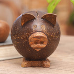 Coconut shell coin bank, 'Prosperous Piggy' - Handcrafted Brown Coconut Shell Pig Coin Bank from Bali