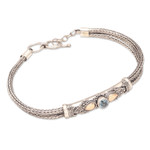 Gold-accented blue topaz pendant bracelet, 'Front to Back in Blue' - Blue Topaz Naga Chain Bracelet with Gold-Accented Pendant