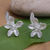 Sterling silver button earrings, 'Enchanting Lilies' - Sterling Silver Floral and Leafy Button Earrings from Bali