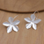 Sterling silver dangle earrings, 'Star Blooming' - Sterling Silver Dangle Earrings with Floral Design
