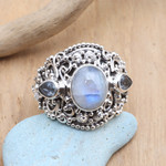 Rainbow moonstone and blue topaz cocktail ring, 'Nirvana Plumeria' - Rainbow Moonstone Blue Topaz and 925 Silver Cocktail Ring