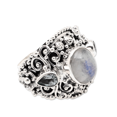 Rainbow moonstone and blue topaz cocktail ring, 'Nirvana Plumeria' - Rainbow Moonstone Blue Topaz and 925 Silver Cocktail Ring