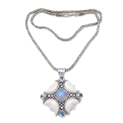 Rainbow moonstone and blue topaz pendant necklace, 'Gianyar's Moon' - Moon Pendant Necklace with Blue Topaz and Rainbow Moonstone