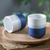 Ceramic cups, 'Snowy Midnight' (pair) - Set of 2 Speckled Ceramic Cups in Blue and White Hues