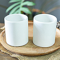 Ceramic cups, 'Enjoy the Day' (pair) - Set of 2 Handcrafted Minimalist White Ceramic Cups from Bali