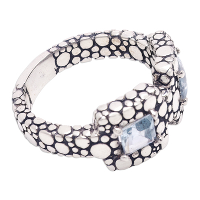 Blue topaz band ring, 'Loyal Vision' - Bubble-Patterned Band Ring with Faceted Blue Topaz Gems