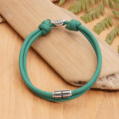 Sterling silver pendant cord bracelet, 'Lagoon Minimalism' - Green Nylon Cord Bracelet with Sterling Silver Accent