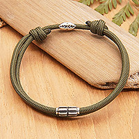 Sterling silver pendant cord bracelet, 'Nature Minimalism' - Dark Green Nylon Cord Bracelet with Sterling Silver Accent