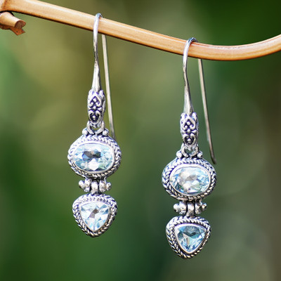 Blue topaz drop earrings, 'Woman's Love in Blue' - Balinese Sterling Silver Drop Earrings with Blue Topaz Stone