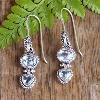 Blue topaz drop earrings, 'Woman's Love in Blue' - Balinese Sterling Silver Drop Earrings with Blue Topaz Stone