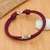 Sterling silver pendant cord bracelet, 'Wine Sparkle' - Adjustable Burgundy Nylon Cord Bracelet with Polished Accent