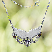 Amethyst and garnet pendant necklace, 'Celestial Wings' - Wing-Themed Pendant Necklace with Amethyst and Garnet Gems