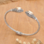 Gold-accented cuff bracelet, 'Golden Eden' - 18k Gold-Accented Cuff Bracelet with Classic Motifs