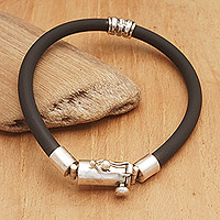 Men's sterling silver pendant bracelet, 'Tight Bond' - Men's Cord Bracelet with Sterling Silver Pendant