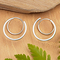 Sterling silver hoop earrings, 'Swirly Ocean' - Minimalist Polished Swirly Sterling Silver Hoop Earrings
