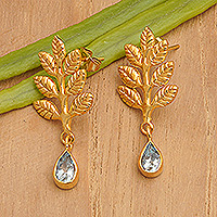 Gold-plated blue topaz dangle earrings, 'Thriving Blue' - 22k Gold-Plated Leafy Dangle Earrings with Blue Topaz Gems