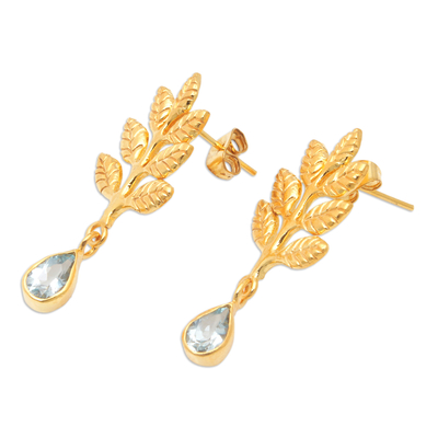 Gold-plated blue topaz dangle earrings, 'Thriving Blue' - 22k Gold-Plated Leafy Dangle Earrings with Blue Topaz Gems