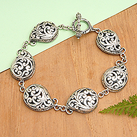 Sterling silver link bracelet, 'Ancestral Enchantment' - Sterling Silver Link Bracelet with Traditional Motifs