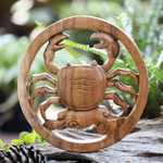 Wood relief panel, 'Cancer Firmament' - Cancer-Themed Hand-Carved Round Suar Wood Relief Panel