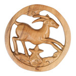 Wood relief panel, 'Capricorn Firmament' - Capricorn-Themed Hand-Carved Round Suar Wood Relief Panel