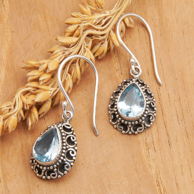 Blue topaz dangle earrings, 'Luxurious Winds in Blue' - Sterling Silver Dangle Earrings with Faceted Blue Topaz Gems