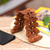 Wood phone holder, 'The Leaves' - Hand-Carved Polished Leafy Jempinis Wood Phone Holder