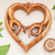 Wood relief panel, 'The Promise of Love' - Hand-Carved Heart-Shaped Brown Suar Wood Relief Panel (image 2) thumbail