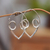 Sterling silver hoop earrings, 'Romantic Sensations' - Polished Abstract Sterling Silver Hoop Earrings from Bali