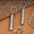 Sterling silver dangle earrings, 'Bubble Empress' - Bubble-Patterned Cylindrical Sterling Silver Dangle Earrings