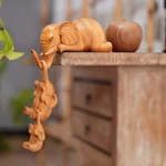 Wood hanging sculpture, 'Family Fun' (set of 3) - Hand-Carved Elephant Suar Wood Sculptures (Set of 3)
