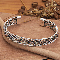 Men's sterling silver cuff bracelet, 'Woven Legends' - Men's Polished Sterling Silver Cuff Bracelet from Bali