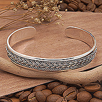 Men's sterling silver cuff bracelet, 'Braids of Fate' - Men's Sterling Silver Cuff Bracelet with Braided Accents