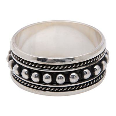 Men's sterling silver spinner ring, 'Memory Beads' - Dot-Patterned Classic Sterling Silver Spinner Ring from Bali