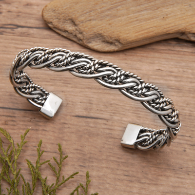 Sterling silver cuff bracelet, 'Double Encounters' - Polished Sterling Silver Cuff Bracelet with Rope Accents