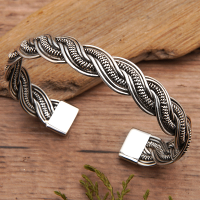 Sterling silver cuff bracelet, 'The Island's Fate' - Classic Braided Sterling Silver Cuff Bracelet from Bali