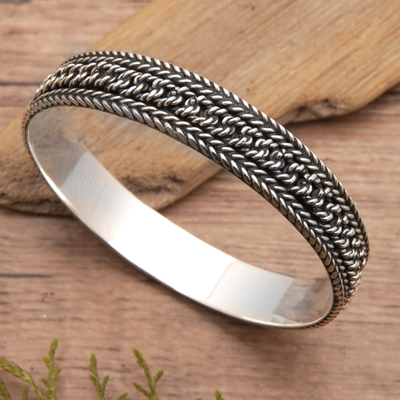 Sterling silver bangle bracelet, 'Braid Shake' - Traditional Braided Sterling Silver Bangle Bracelet from Bal