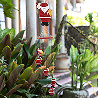 Wood mobile, 'Waving Santa' - Hand-Painted Santa-Themed Albesia Wood Mobile from Bali