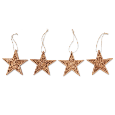 Wood ornaments, 'Morning Grace' (set of 4) - Set of 4 Traditional Star-Shaped Suar Wood Ornaments