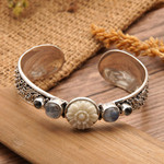 Blue topaz and rainbow moonstone cuff bracelet, 'Charming Shades' - Traditional Blue Topaz and Rainbow Moonstone Cuff Bracelet