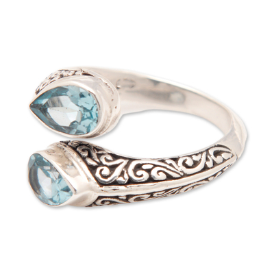 Blue topaz wrap ring, 'Two Marvels' - Sterling Silver Wrap Ring with Two Faceted Blue Topaz Stones